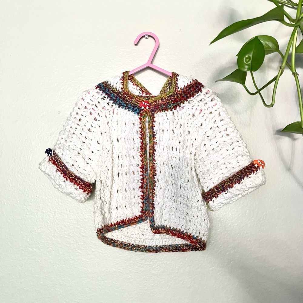 Custom hand knit rainbow cardigan with car buttons